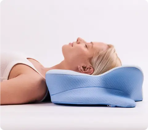 Back sleeper supported by Derila Ergo Pillow cervical contour